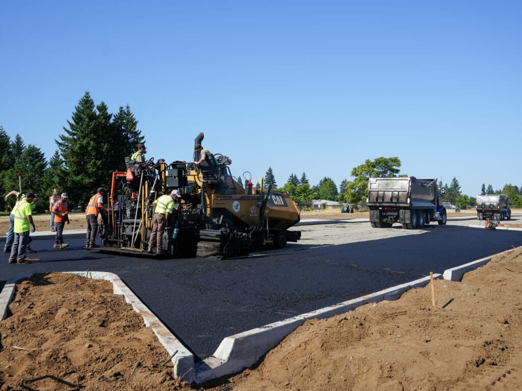 Paving crew laying a new parking lot
