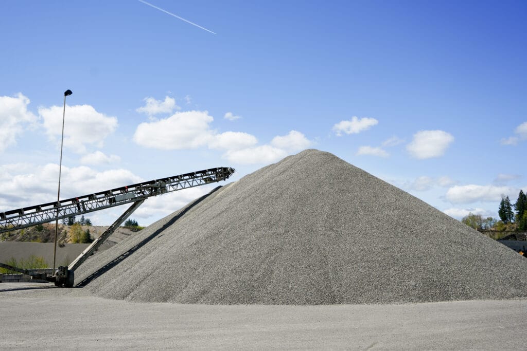 Crushed rock stockpile and conveyor at a Lakeside plant