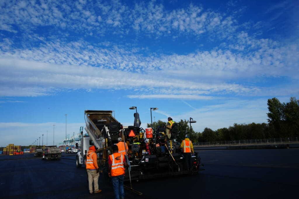 Paving crew laying asphalt at the Port of Portland, OR